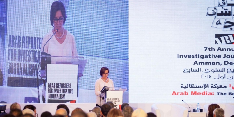 A photo of Rana giving a speech at a podium in front of an audience.